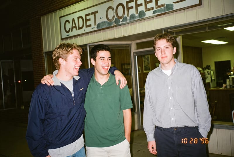 Photograph of two cadets with coffee cups
